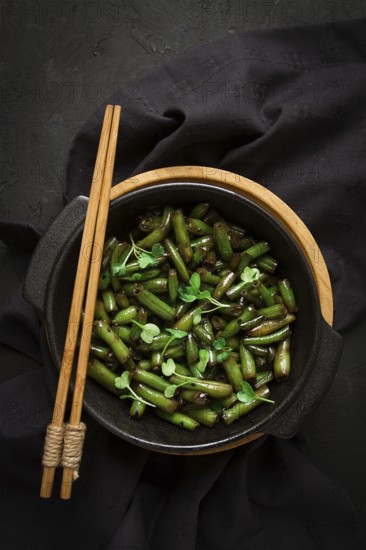 Fried bean pods, in soy sauce, with sesame seeds, homemade, no people