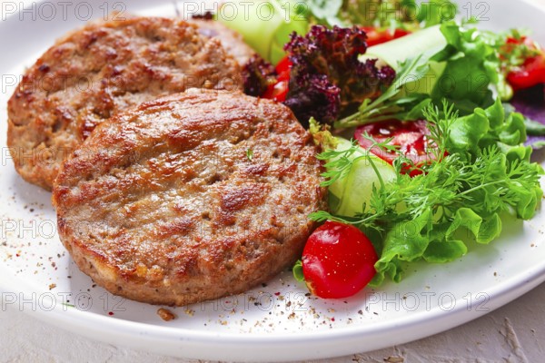 Fried cutlets, turkey, with vegetable salad, top view, no people