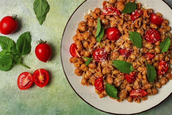 Tuscan pasta with smoked paprika and basil, parmesan cheese, Italian traditional cuisine
