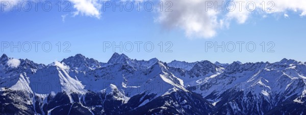 Alpine panorama with snow-covered mountain peaks in winter. Taken in the ski resort of Serfaus Fiss
