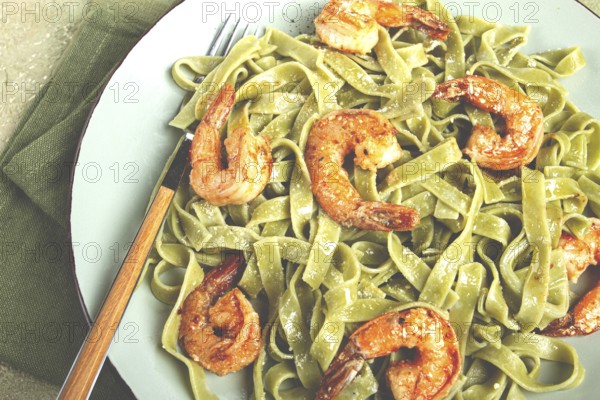 Tagliatelle with spinach, in cream sauce, with shrimp, homemade, no people
