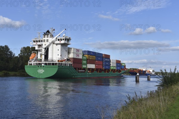 Container ship Elbspring travelling through the siding in the Kiel Canal, Schleswig-Holstein,