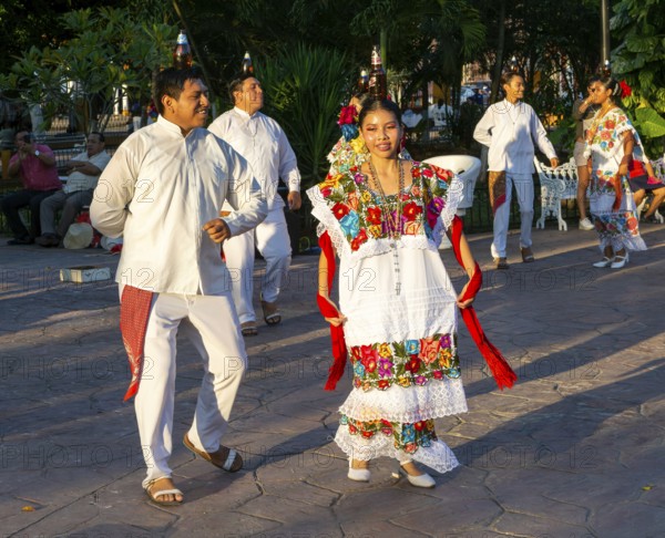 Folk dancers with bottles balanced on their heads, Francisco Cantón Rosado Park, Valladolid,