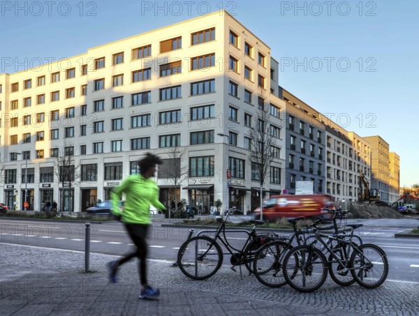 A jogger in the Europacity Berlin development area on Heidestrasse. The Europacity project covers