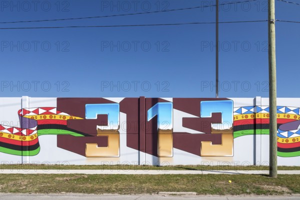 Detroit, Michigan, Detail of a mural that stretches for several blocks, by artist Hubert Massey.