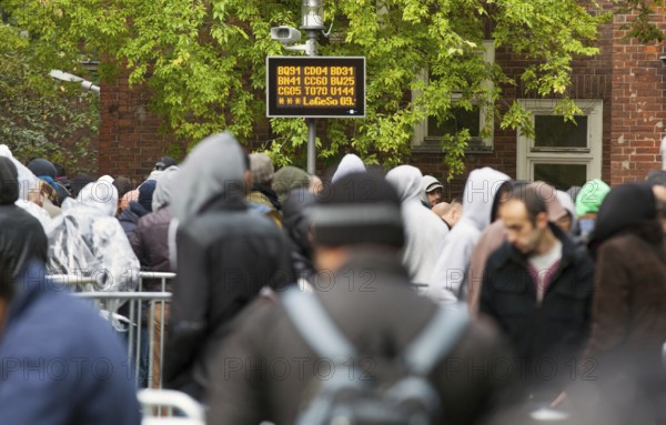 Refugees from Syria waiting to be registered at the Central Reception Centre for Asylum Seekers at