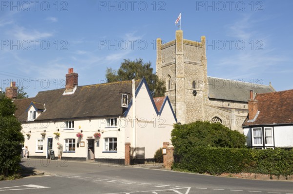 The Kings Head Inn and village church, Orford, Suffolk, England, UK