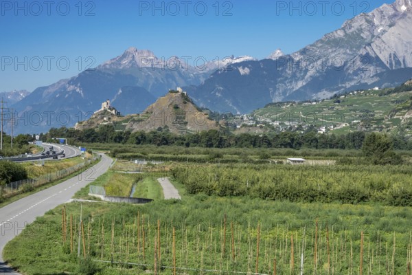 View over vineyards to castles of Sierre and Sion in the Rhone valley, Rhone highway A9 to the