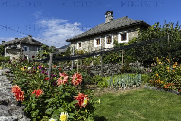 View of the village, typical Ticino stone houses in the mountain village of Rasa, Centovalli,