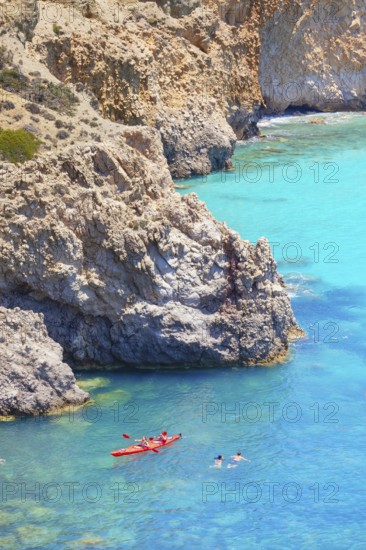 Group of people Kayaking, Tsigrado, Milos Island, Cyclades Islands, Greece, Europe