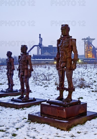 People made of iron, multi-part iron sculpture by Zbigniew Fraczkiewicz in front of the