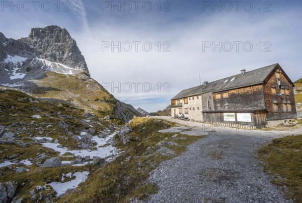 Lamsenjochhütte in autumn, rocky summit of the Lamsenspitze behind, Karwendel, Tyrol, Austria,