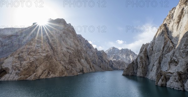 Mountain lake Kol Suu rocky steep mountains, sun star, Kol Suu Lake, Kurumduk Valley, Sary Beles
