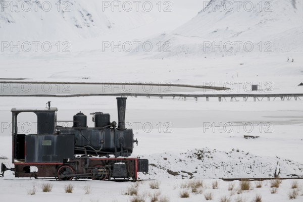 Historic mine railway in winter landscape, Kongsfjord, Ny-Ålesund, Spitsbergen Island, Svalbard and