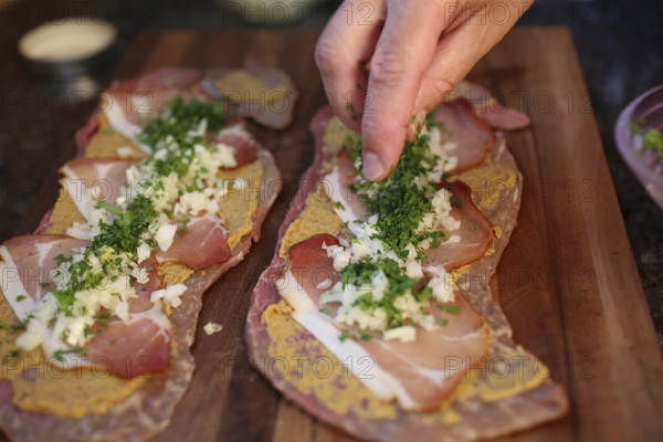 Swabian cuisine, preparation of beef roulade with pine nuts, meat dish, raw beef with Black Forest