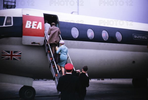 Passengers boarding a BEA aircraft via a staircase, 1966