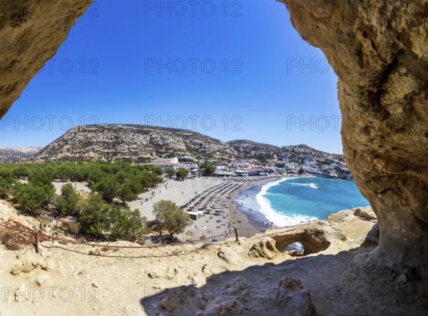 View from the rock caves to the beach of Matala, south coast, Crete, Greece, Europe