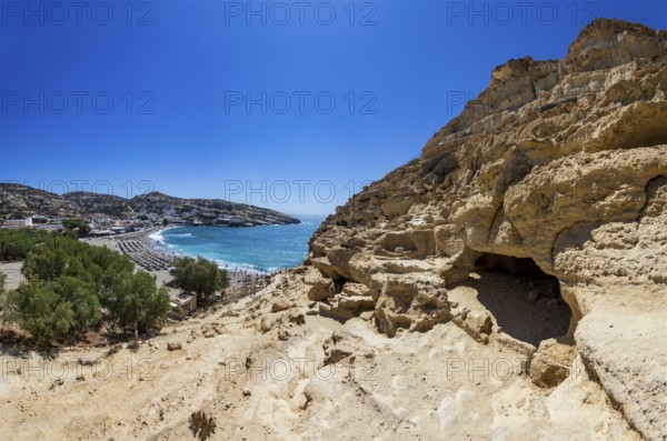View from the rock caves to the beach of Matala, south coast, Crete, Greece, Europe