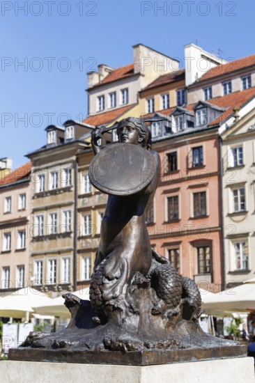 Market square with mermaid Syrenka and historic buildings in the old town centre of Warsaw, Poland,