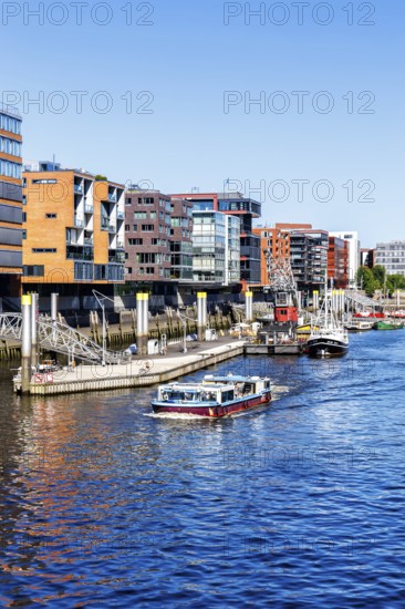 Building in the HafenCity Sandtorhafen harbour with boats in Hamburg, Germany, Europe