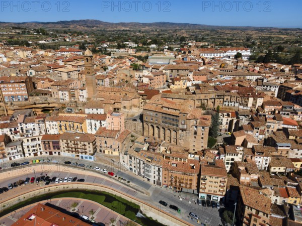 Aerial view of a historic city with many narrow streets and tiled roofs, aerial view, church,
