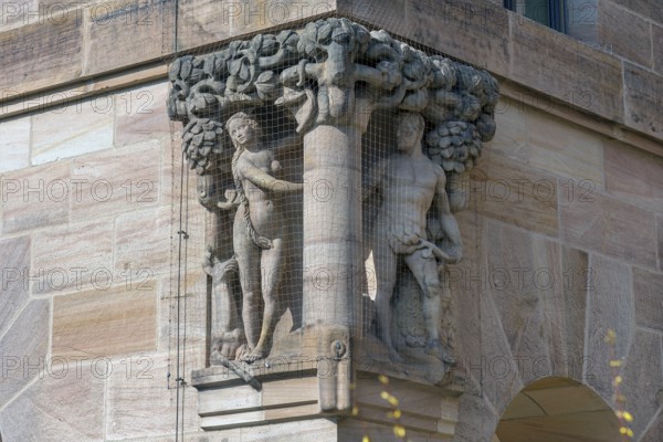 Scene of Adam and Eve in Paradise, stone sculptures on the courthouse, built between 1909 and 1916