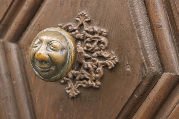 Stahlesches Schwesternhaus in the street Eisgrube in Bamberg. Doorknob with a cheerful face, known