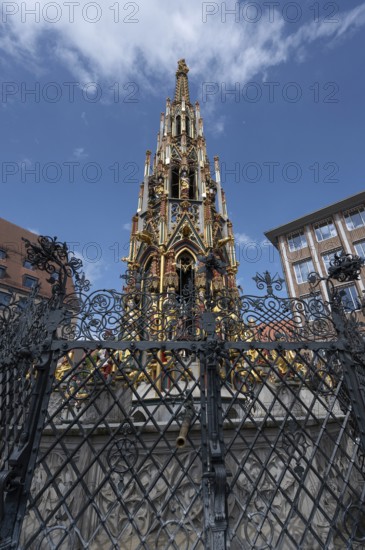 The 19 metre high Schöne Brunnen fountain on the Hauptmarkt is a copy made of shell limestone in