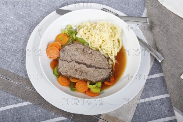 Swabian cuisine, roast beef, roast ox, herb spaetzle, meat dish, gravy, carrot vegetables, leek,