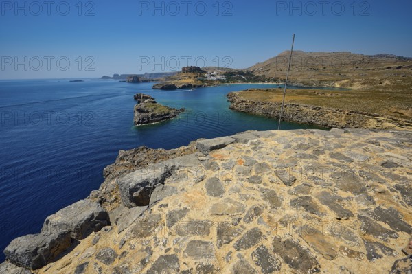 Extensive view of the blue sea and the rocky coast on a clear day, tomb of Cleovoulos the Lindier,