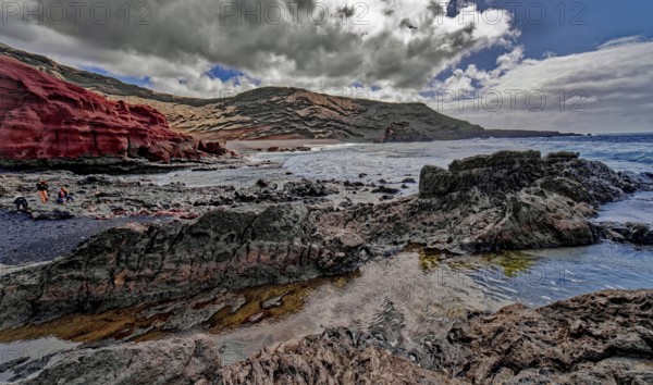 Lava rocks at the Playa de los Ciclos near the Green Lake, Lago Verde, El Golfo, Lanzarote, Canary