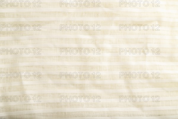 Fragment of smooth white linen tissue. Top view, flat lay, natural textile background and texture