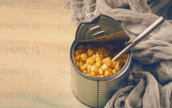 Open tin can, with corn, top view, selective focus, no people, close-up