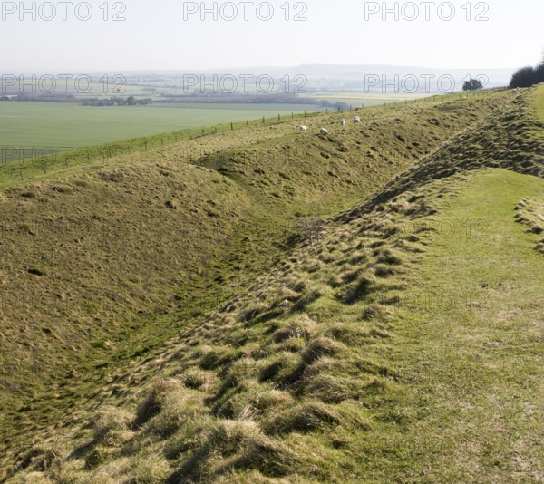 Defensive ditch and rampart at Barbury Castle Country Park, Iron Age hill fort, Wiltshire, England,