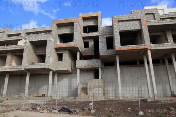 Concrete shells of uncompleted housing in the Castillo development, Caleta de Fuste, Fuerteventura,