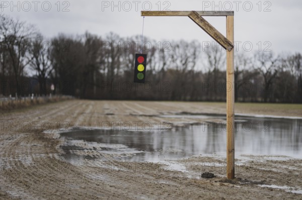 A gallows with a symbolic traffic light stands in a field near Gablenz, 14 Jan. 2024. As part of