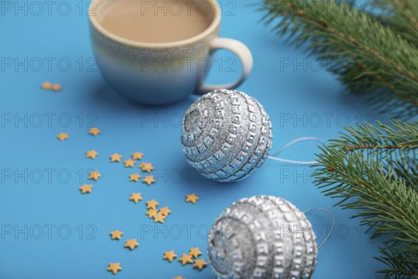 Christmas or New Year composition. Decorations, silver balls, fir and spruce branches, cup of