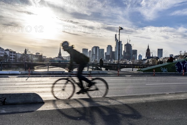 Skyline of Frankfurt am Main, skyscrapers, cyclists on the Flößerbrücke, Hesse, Germany, Europe