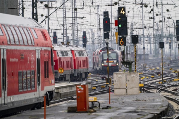 Railway tracks with regional trains, after freezing rain, in front of Frankfurt main station,