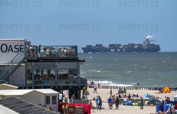 Beach of Domburg, in Zeeland, South Holland, Netherlands, in the background a container freighter