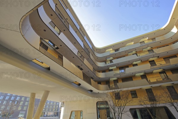 Modern golden building Pandion Doxx, golden, residential complex, inner courtyard, customs harbour,