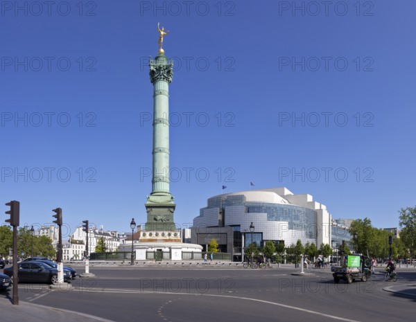 Victory Column on a large, sunny square in front of modern architecture, Paris
