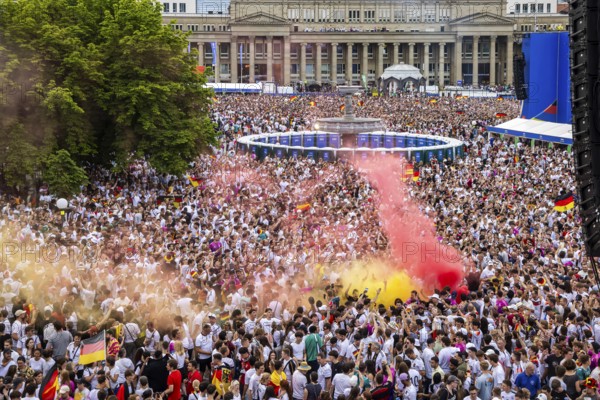 UEFA European Football Championship. Enthusiastic fans with pyrotechnics, public viewing in the