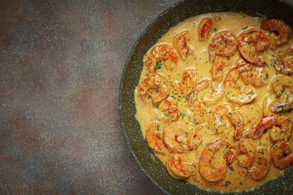 Shrimp in creamy garlic sauce, with spices and herbs