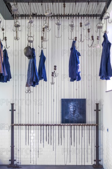 Changing room with pulleys and chains to hoist coal miners clothes at Le Bois du Cazier, coal