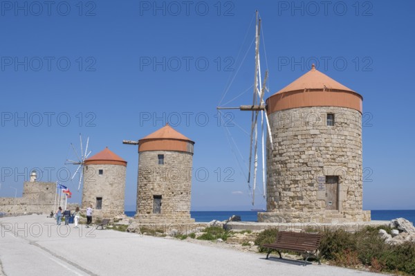 Windmills on the pier at Mandráki harbour, Rhodes Town, Rhodes, Dodecanese, Greece, Europe