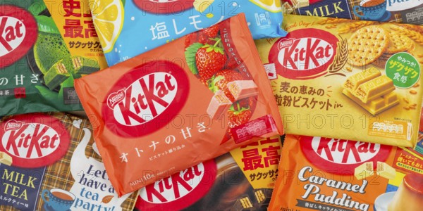 Different flavours of KitKat Kit Kat chocolate bar from Japan by Nestle as background panorama