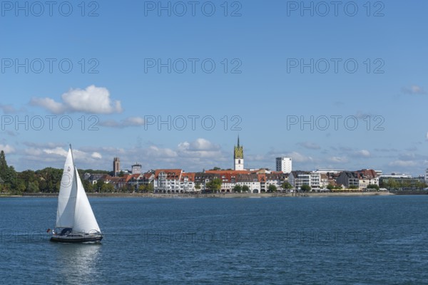 Cityscape, lakeside promenade, sailing boat, church tower, St. Nicholas Church, Friedrichshafen on