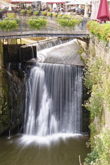 Waterfall of the Leuk and bridge over the Leukbach in the centre of Saarburg. Saarburg,