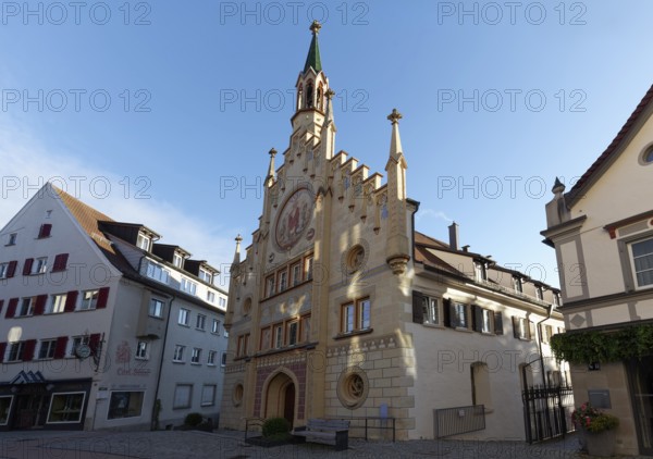 Hospital of the Holy Spirit, neo-Gothic façade, morning light, historic old town, Bad forest lake,